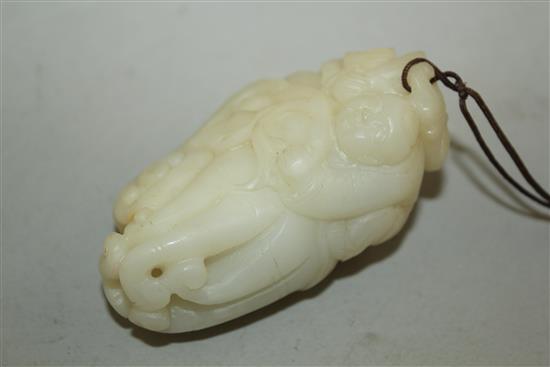 A Chinese white jade carving of a boy clambering on a finger citron, 7.7cm